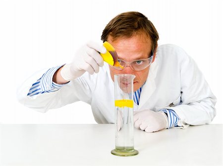 Chemist, dripping a yellow substance in a measuring beaker Stock Photo - Budget Royalty-Free & Subscription, Code: 400-05177692