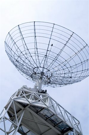 radio antenna dish space - Communication radar on a cloudy sky Stock Photo - Budget Royalty-Free & Subscription, Code: 400-05177727