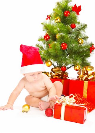 Baby looking at Christmas presents, isolated Stock Photo - Budget Royalty-Free & Subscription, Code: 400-05178600