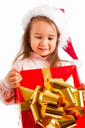 decorating small xmas tree - Lovely preschool girl carrying a large present box Stock Photo - Budget Royalty-Free & Subscription, Code: 400-05178638