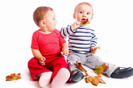 Babies playing with autumn leaves Stock Photo - Budget Royalty-Free & Subscription, Code: 400-05178639