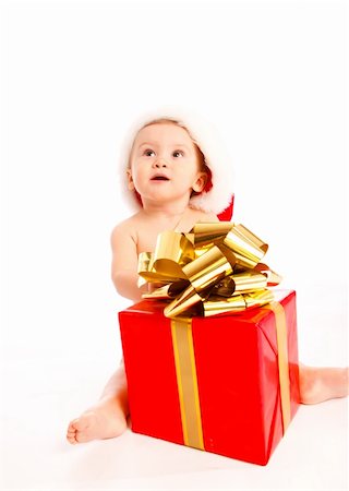 Baby with Christmas present looking up Stock Photo - Budget Royalty-Free & Subscription, Code: 400-05178630