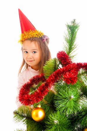decorating small xmas tree - Lovely preschool girl decorating Christmas tree Stock Photo - Budget Royalty-Free & Subscription, Code: 400-05178658