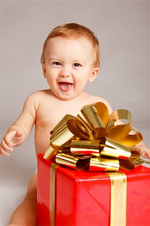 Little boy with Xmas present Stock Photo - Budget Royalty-Free & Subscription, Code: 400-05178651