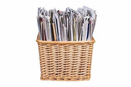 Straw colored wicker basket with newspapers and catalogs with clipping path Stockbilder - Microstock & Abonnement, Bildnummer: 400-05178863