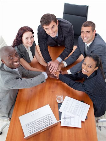 High angle of business people with hands together  in a meeting Stock Photo - Budget Royalty-Free & Subscription, Code: 400-05179267