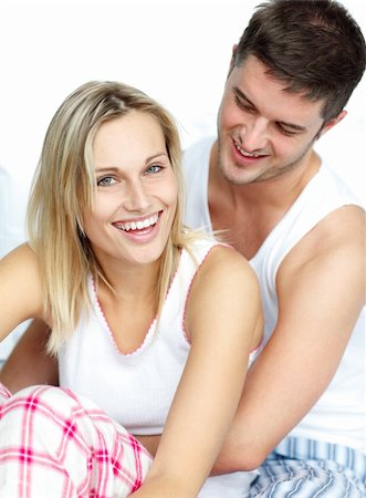 Young lovers together sitting on bed Stock Photo - Budget Royalty-Free & Subscription, Code: 400-05179279