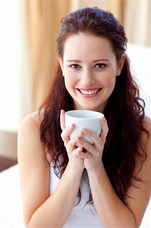 simsearch:693-08127560,k - Beautiful woman drinking a cup of coffee in bedroom in the morning Stock Photo - Budget Royalty-Free & Subscription, Code: 400-05179450