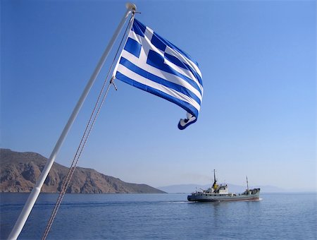 simsearch:400-05052257,k - Sea view with greek flag, mountain and cargo ship Stock Photo - Budget Royalty-Free & Subscription, Code: 400-05179822