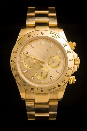 simsearch:614-06402951,k - Luxury gold watch isolated on black background Foto de stock - Super Valor sin royalties y Suscripción, Código: 400-05179854