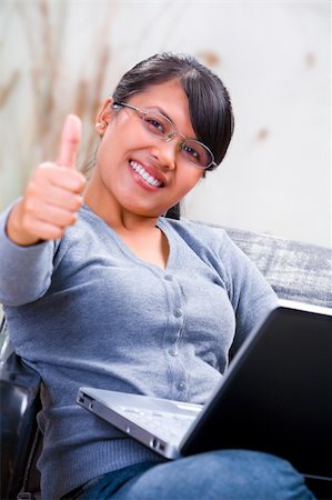 Portrait of a young Asian woman showing her satisfaction Stock Photo - Budget Royalty-Free & Subscription, Code: 400-05170127