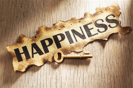 simsearch:400-04138611,k - Key to happiness concept using burnt paper with word happiness printed on it and golden key placed on its side Stock Photo - Budget Royalty-Free & Subscription, Code: 400-05170355