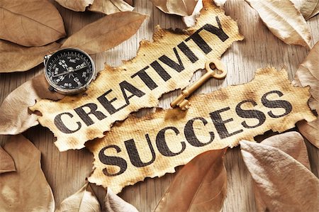 Creativity is key to success concept using words printed on burnt paper and related objects, surrounded with dry leaf Stock Photo - Budget Royalty-Free & Subscription, Code: 400-05170351