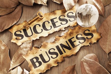 simsearch:400-04138611,k - Key to success in global business concept using words printed on burnt paper and related objects, surrounded with dry leaf Stock Photo - Budget Royalty-Free & Subscription, Code: 400-05170353