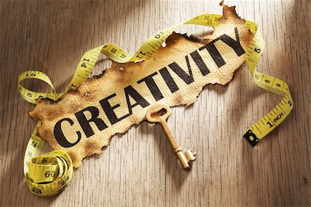 simsearch:400-04138611,k - Measuring creativity concept using burnt paper with word creativity printed on it and golden key surrounded by measuring tape Stock Photo - Budget Royalty-Free & Subscription, Code: 400-05170360