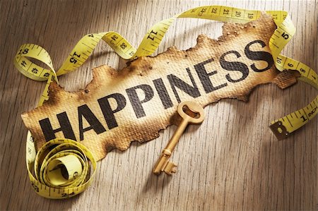 simsearch:400-04138611,k - Measuring happiness concept using burnt paper with word happiness printed on it and golden key surrounded by measuring tape Stock Photo - Budget Royalty-Free & Subscription, Code: 400-05170361