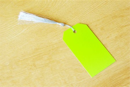 simsearch:400-04752957,k - paper tag isolated on a wooden background Photographie de stock - Aubaine LD & Abonnement, Code: 400-05170411