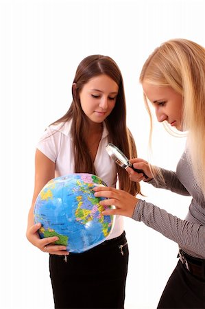 Two happy young  girls with globe on white Stock Photo - Budget Royalty-Free & Subscription, Code: 400-05170496