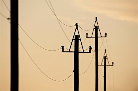 Electricity pylons at orange sunset Photographie de stock - Aubaine LD & Abonnement, Code: 400-05171140