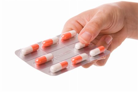 simsearch:400-05892402,k - Woman hand holding a tablet with orange capsules Stock Photo - Budget Royalty-Free & Subscription, Code: 400-05172099