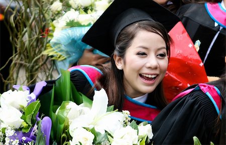 diploma master - Portrait of a beautiful Asian university graduate in robes. Photographie de stock - Aubaine LD & Abonnement, Code: 400-05172193