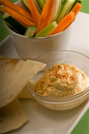middle eastern hummus dip on a glass bowl with homemade pita bread and raw vegetable Stock Photo - Budget Royalty-Free & Subscription, Code: 400-05184999