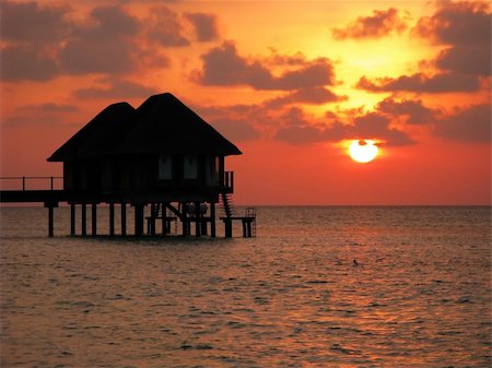 water houses and sunset glow of Maldives island Stock Photo - Budget Royalty-Free & Subscription, Code: 400-05184992