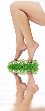 foot daisy - woman legs walking on small peace of green grass isolated on white representing last oasis concept Stock Photo - Budget Royalty-Free & Subscription, Code: 400-05185187