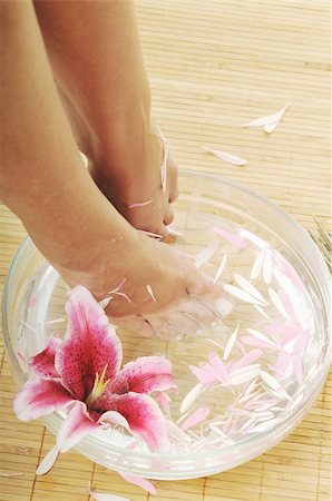 smelling feet - woman spa pedicure foot treatment with water and flower Stock Photo - Budget Royalty-Free & Subscription, Code: 400-05185234