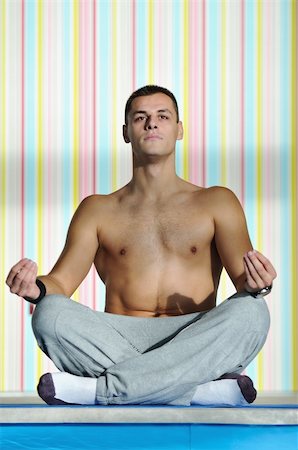 simsearch:400-04335941,k - young man exercise and practice yoga fitness  in lotus position indoor Stock Photo - Budget Royalty-Free & Subscription, Code: 400-05185345