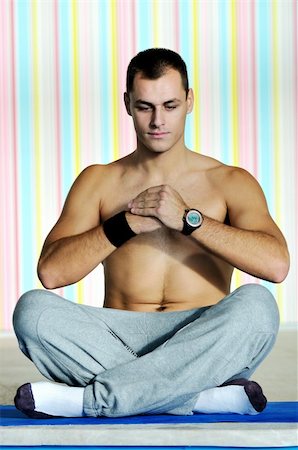 simsearch:400-04335941,k - young man exercise and practice yoga fitness  in lotus position indoor Stock Photo - Budget Royalty-Free & Subscription, Code: 400-05185340