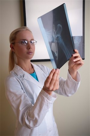 Doctor examining x-ray Stock Photo - Budget Royalty-Free & Subscription, Code: 400-05186276