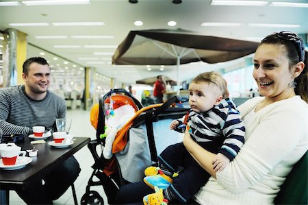 parents shopping trolley - happy young family in shopping centre indoor Stock Photo - Budget Royalty-Free & Subscription, Code: 400-05186337