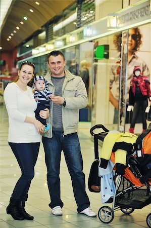 parents shopping trolley - happy young family in shopping centre indoor Stock Photo - Budget Royalty-Free & Subscription, Code: 400-05186339