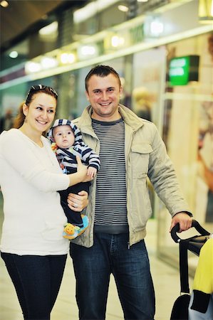 parents shopping trolley - happy young family in shopping centre indoor Stock Photo - Budget Royalty-Free & Subscription, Code: 400-05186345