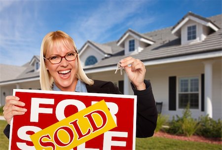 simsearch:400-04350998,k - Beautiful Female Holding Keys to a New House & Sold Real Estate Sign. Stock Photo - Budget Royalty-Free & Subscription, Code: 400-05186673