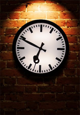 Brick wall with light effect and clock Fotografie stock - Microstock e Abbonamento, Codice: 400-05186719