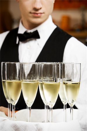 professional waiter in uniform is serving wine Stock Photo - Budget Royalty-Free & Subscription, Code: 400-05187120
