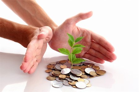 pile hands bussiness - Coins and plant isolated on white background Stock Photo - Budget Royalty-Free & Subscription, Code: 400-05187182