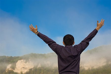 simsearch:400-04982004,k - The man feels freedom. Over blue sky and mountains Stock Photo - Budget Royalty-Free & Subscription, Code: 400-05187350