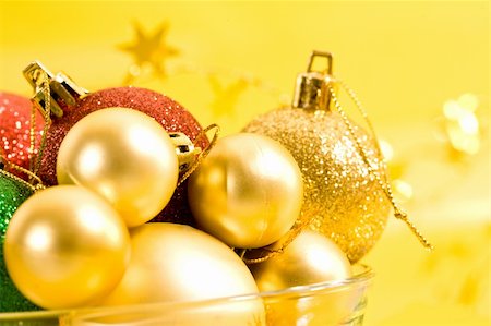 Holiday series: christmas red and golden, blue ball decoration on yellow background Stock Photo - Budget Royalty-Free & Subscription, Code: 400-05187392