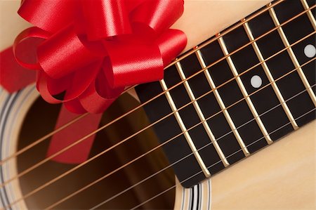 Guitar Strings with Red Ribbon - The Gift of Music. Stock Photo - Budget Royalty-Free & Subscription, Code: 400-05187614