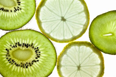 sliced carambola - Sliced Kiwifruit, Lemon and Starfruit isolated on white studio shot Photographie de stock - Aubaine LD & Abonnement, Code: 400-05188293