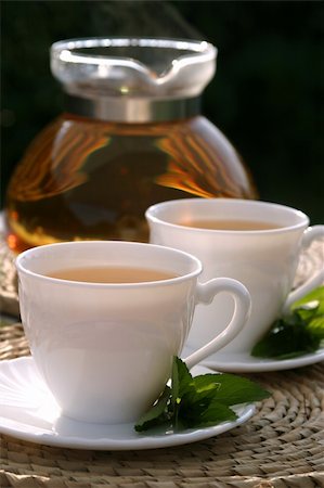 Freshly made mint tea in white cups with mint leaves and teapot Stock Photo - Budget Royalty-Free & Subscription, Code: 400-05188427