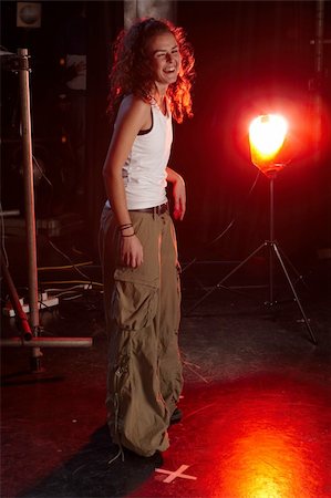A portrait of young female freestyle hip-hop dancer on stage. Lit with spotlights Stock Photo - Budget Royalty-Free & Subscription, Code: 400-05188593