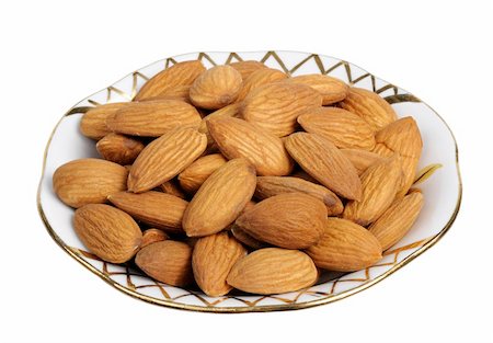 simsearch:400-05189183,k - Almonds in a plate on white background, isolated Foto de stock - Super Valor sin royalties y Suscripción, Código: 400-05189191