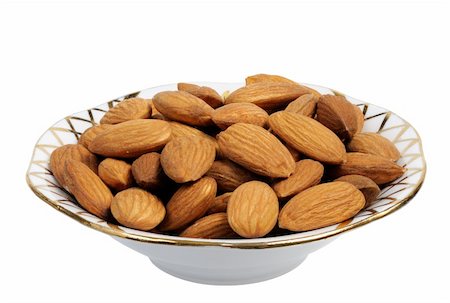 simsearch:400-05189183,k - Almonds in a plate on white background, isolated Foto de stock - Super Valor sin royalties y Suscripción, Código: 400-05189192