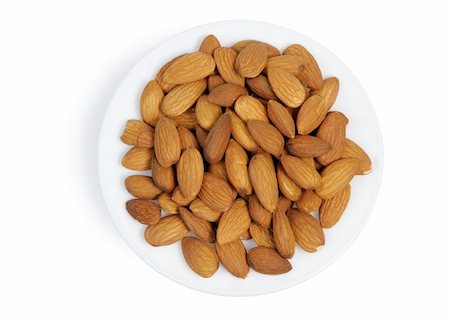 simsearch:400-05189183,k - Almonds in a plate on white background, isolated Foto de stock - Super Valor sin royalties y Suscripción, Código: 400-05189231