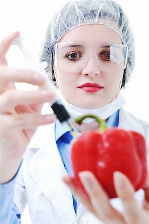 isolated on white young nurse doctor woman with red vegetable food papper representing bio food concept Stock Photo - Budget Royalty-Free & Subscription, Code: 400-05189261