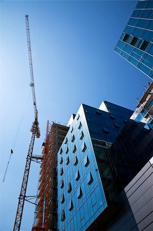 simsearch:400-05161359,k - crane over a construction site of an office building Foto de stock - Super Valor sin royalties y Suscripción, Código: 400-05180007